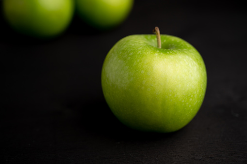 Green Apple and black background