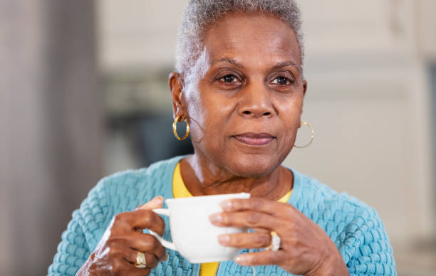 Senior African-American woman drinking cup of tea