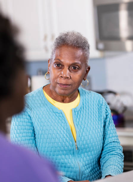 istock Senior African-American woman conversing in kitchen 1489839945