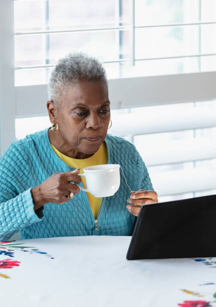 istock Senior African-American woman using digital tablet 1489840015