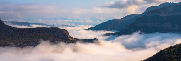 istock Clouds below the tops of the mountains 1489842042