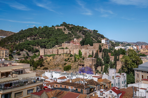 Ronda and Puente Viejo (Old Bridge) . Aerial view of houses, Arab Baths Archaeological Site and cathedral in Ronda, Andalusia, Spain