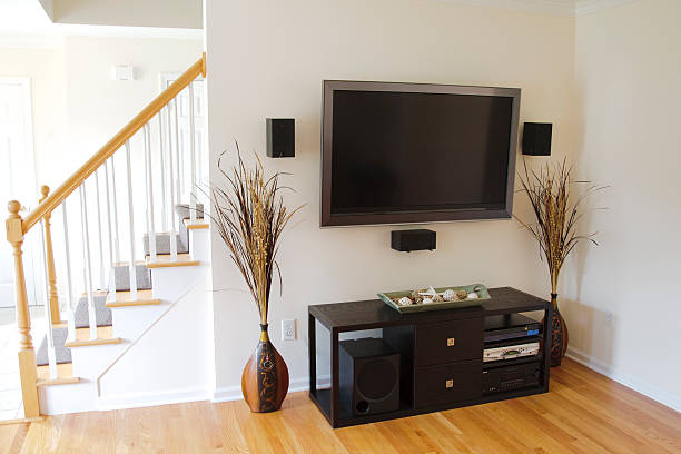 istock TV on the wall with a modern home theater system 148986039