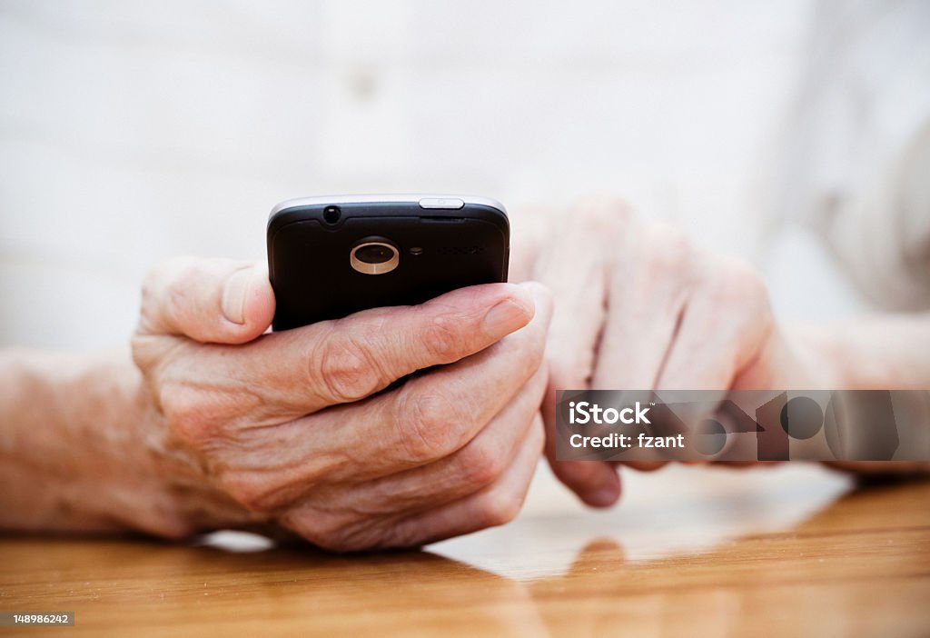 Old man using smart phone Telephone Stock Photo