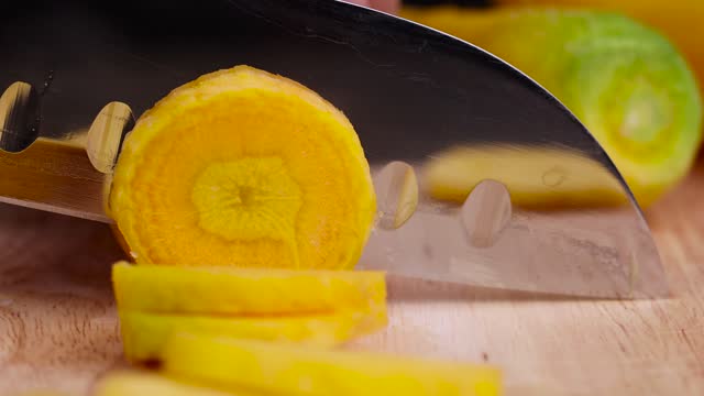Pieces of sliced peeled carrots are yellow