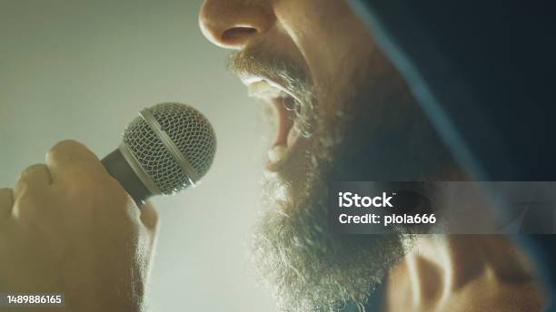 Rock Singer Screaming In A Live Show With Stage Lights Stock Photo - Download Image Now