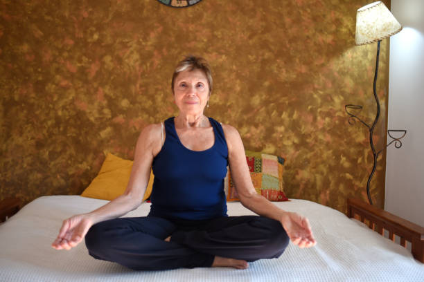 istock woman doing yoga in her room 1489889985