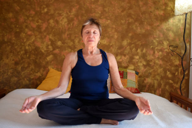 istock woman doing yoga in her room 1489889986