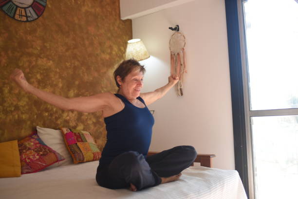 istock woman doing yoga in her room 1489890059