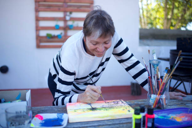 woman painting on a canvas