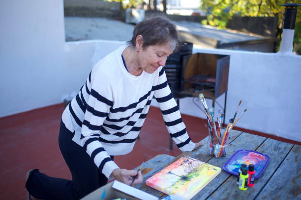 istock woman painting on a canvas 1489890139