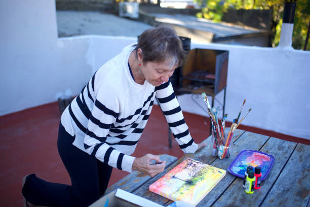 istock woman painting on a canvas 1489890147