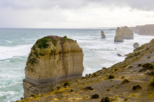 Photograph of the historic and famous 12 Apostles limestone rock stacks along the rugged Great Ocean Road in Victoria in Australia