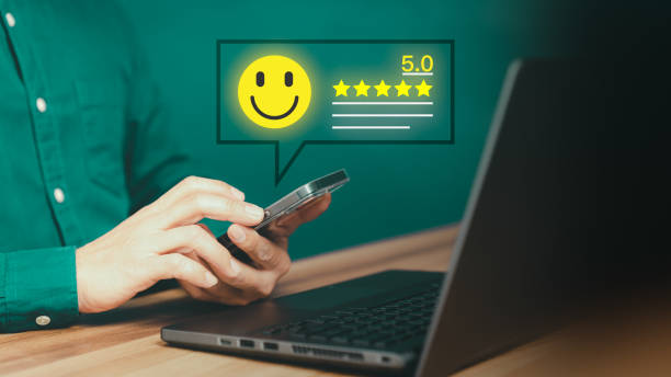 istock Customer using a mobile phone or smartphone in give rating to service experience assessment on application. Online customer review satisfaction feedback survey and testimonial. 1489898344