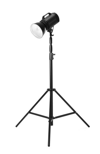 istock Studio flash light on tripod against white background. Professional photographer's equipment 1489899792