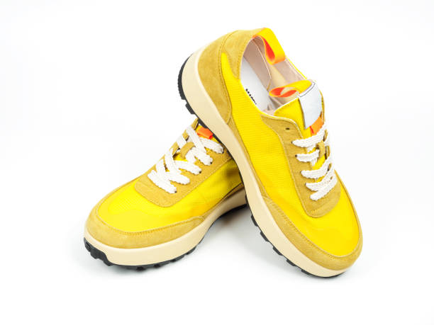 istock Yellow Shoes on White Background 1489906195