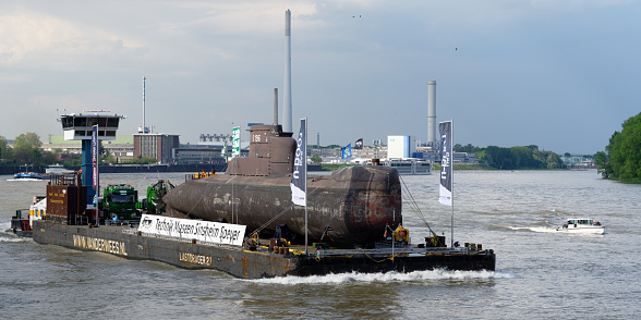 Cologne, Germany, May 13 2023: the historic submarine u17 on the rhine near the fordwerke in cologne on its way to the museum speyer