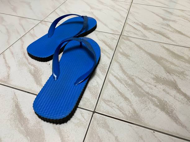 istock Blue slippers isolated on white background. Top view 1489911963