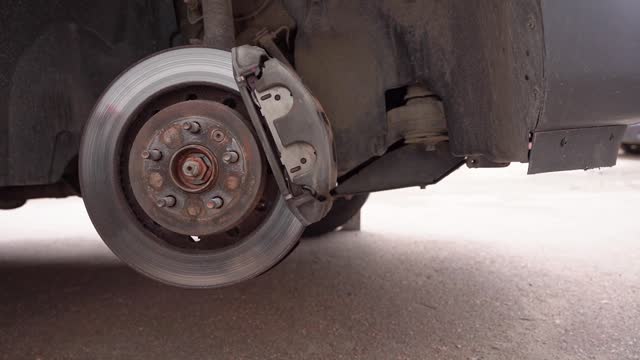 old rusty brake disc close-up. a rusty hub of a car wheel