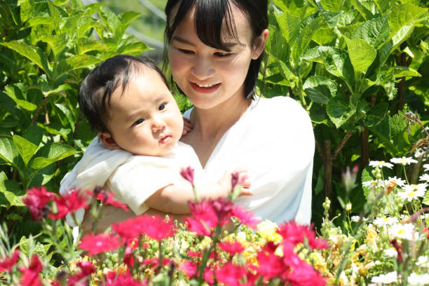 istock Mother and her baby in park 1489913748