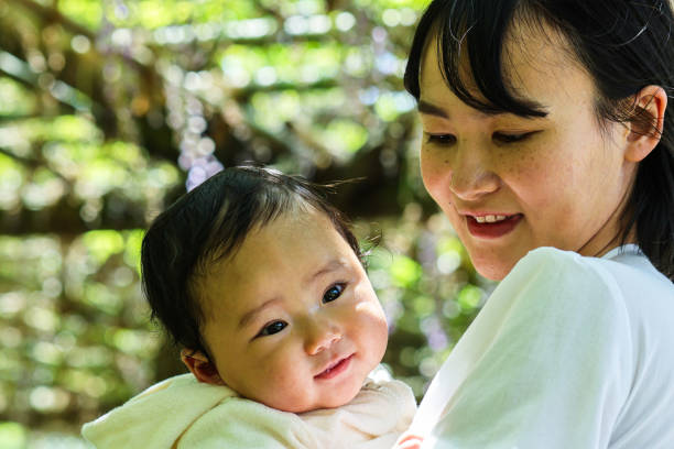 istock Mother and her baby in park 1489913851