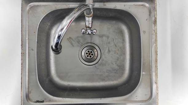 istock the old dirty metal sink on the white tiled kitchen 1489914566