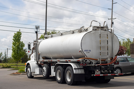 Tigard, OR, USA - May 25, 2022: A waste oil truck is seen in a parking lot in Tigard, Oregon.