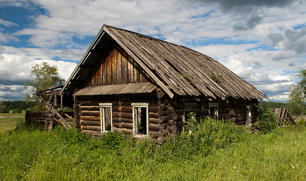 istock Old wooden cottage on the meadow 148991731