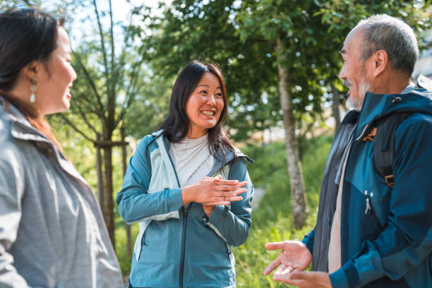 istock Park Stroll: Asian Father, Daughter, and Niece Enjoying Quality Time 1489923577