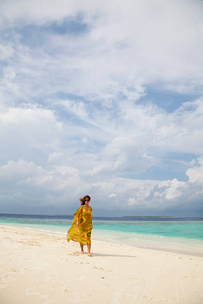 istock Young woman relaxing on beach 148992482