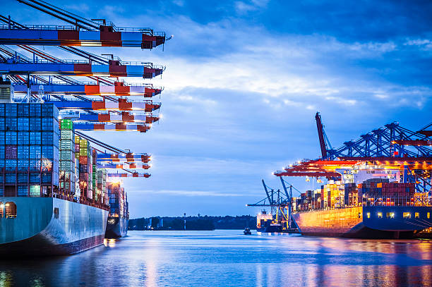 Container Terminal Container terminal with huge container cargo ship ready for unloading hamburg germany photos stock pictures, royalty-free photos & images