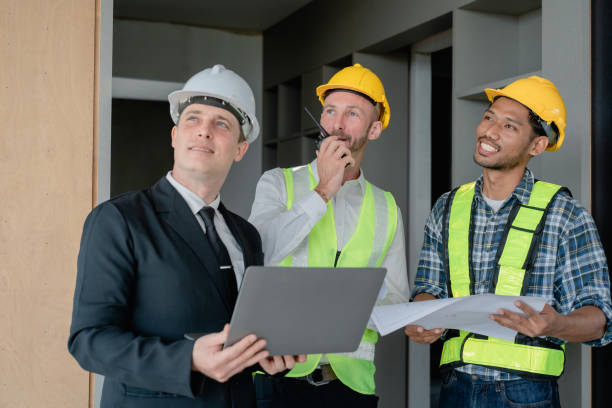 istock multi ethnic engineer brainstorming and measuring for cost estimating on blueprint and floor plan drawings about design architectural and engineering for houses and buildings 1489929685