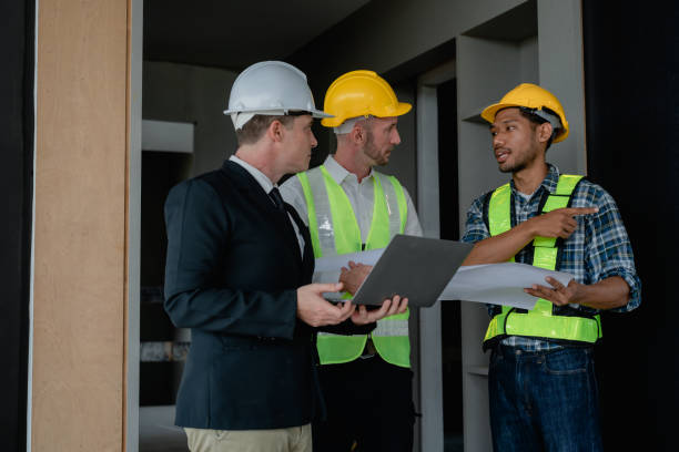 istock multi ethnic engineer brainstorming and measuring for cost estimating on blueprint and floor plan drawings about design architectural and engineering for houses and buildings 1489929717