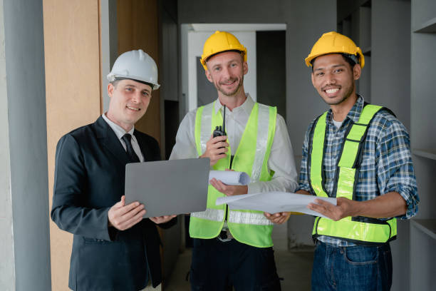 istock multi ethnic engineer brainstorming and measuring for cost estimating on blueprint and floor plan drawings about design architectural and engineering for houses and buildings 1489929735