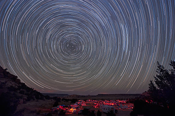 Star trails over starparty stock photo
