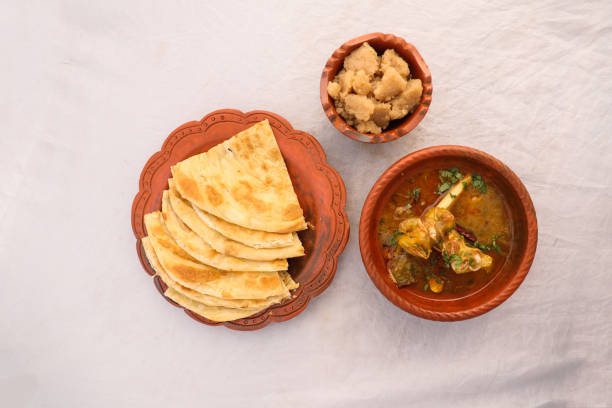 desi breakfast Mutton nalli nihari, Halwa and paratha served in dish isolated on background top view of bangladesi breakfast