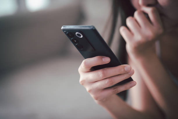 istock sad people casual wear sitting on sofa using call talking  mobile phone during Symptoms  unhappy female holding his forehead while having headache receive a bad news message. 1489938540