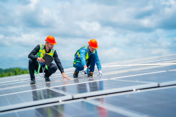 istock Technician engineer planning to setting solar panel on the roof of the building to work at full efficiency, Using solar cells for energy saving to save and protect environment. Renewable energy 1489946666