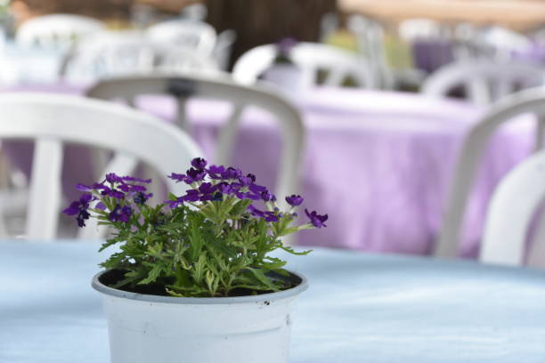 A bouquet of flowers on a table at a wedding