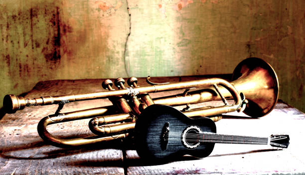 istock an old trumpet and a classical guitar on an old table 1489955996
