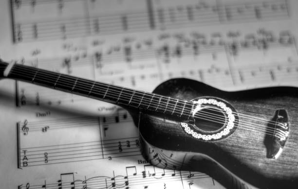 istock a classical guitar above the Notes of a new song 1489956029