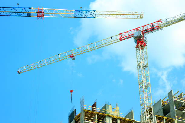 istock two tower cranes on the background of a construction site 1489957460