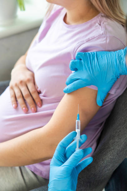 istock A pregnant woman makes a vaccination. Selective focus. 1489958517