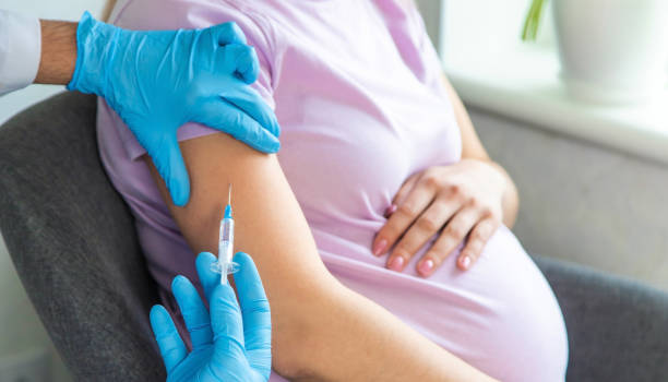 istock A pregnant woman makes a vaccination. Selective focus. 1489958526