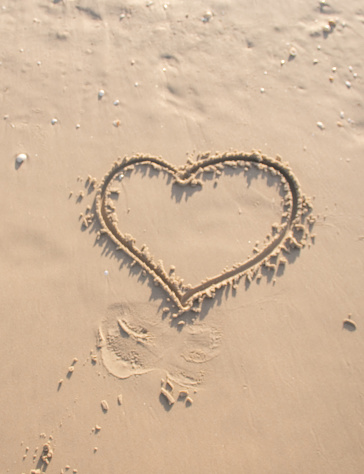 Drawing a heart in the sand