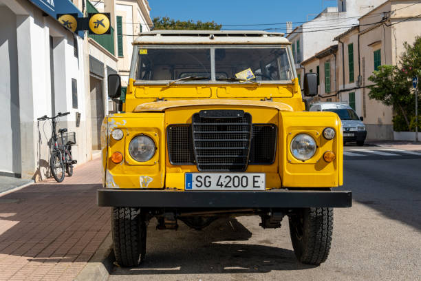 Portocolom, Spain; april 23 2023: Land Rover Santana yellow SUV, parked in the Majorcan town of Portocolom, Spain