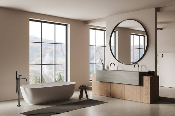 istock Light bathroom interior with bathtub and sink, mirror and panoramic window 1489971356
