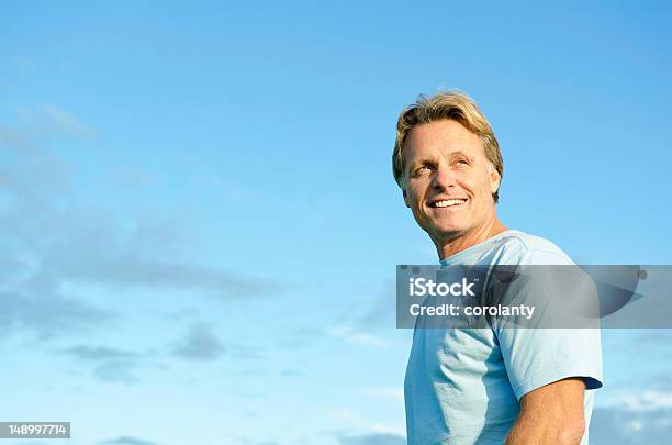 Happy Smiling Man In His Forties Stock Photo - Download Image Now - Men, Blue, Sky