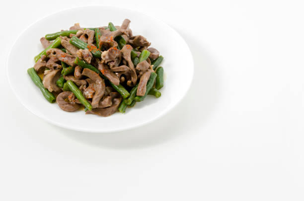 istock stir-fried Pork Heart with green beans on a white background. 1489982527