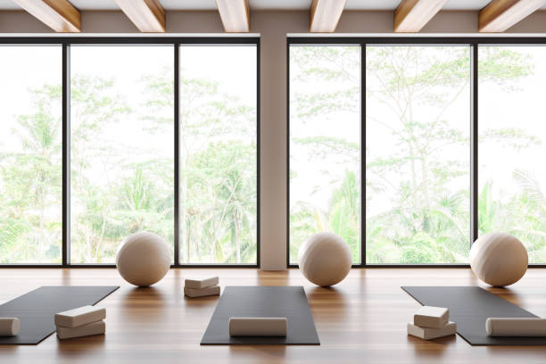 istock Stylish gym class interior with sport equipment in row and panoramic window 1489982549